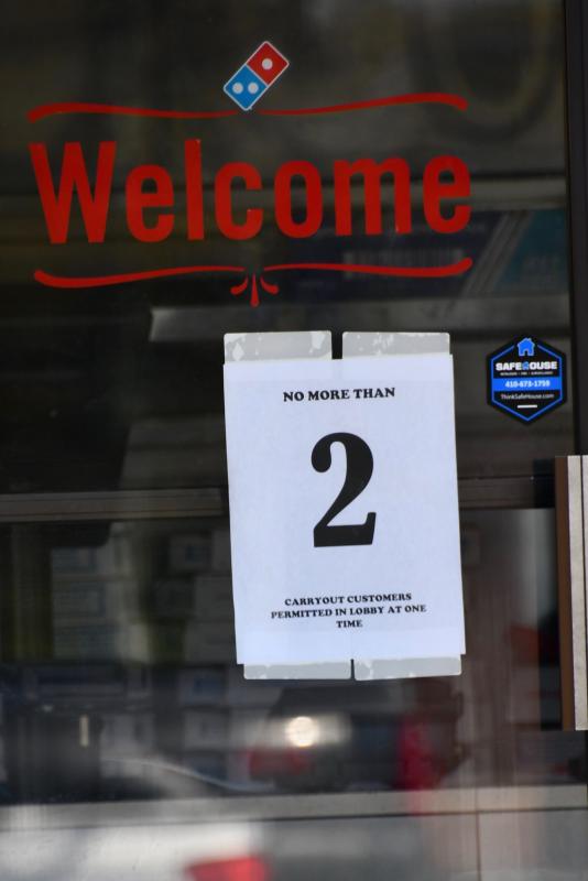 Restaurants, pizza shops, grocery stores and other essential businesses are required to limit the number of people who walk through the door.