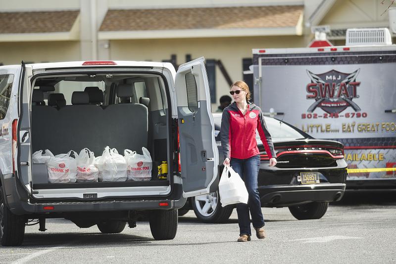 Chelsea Aydelotte helps load up meals to be delivered to local hospitals.