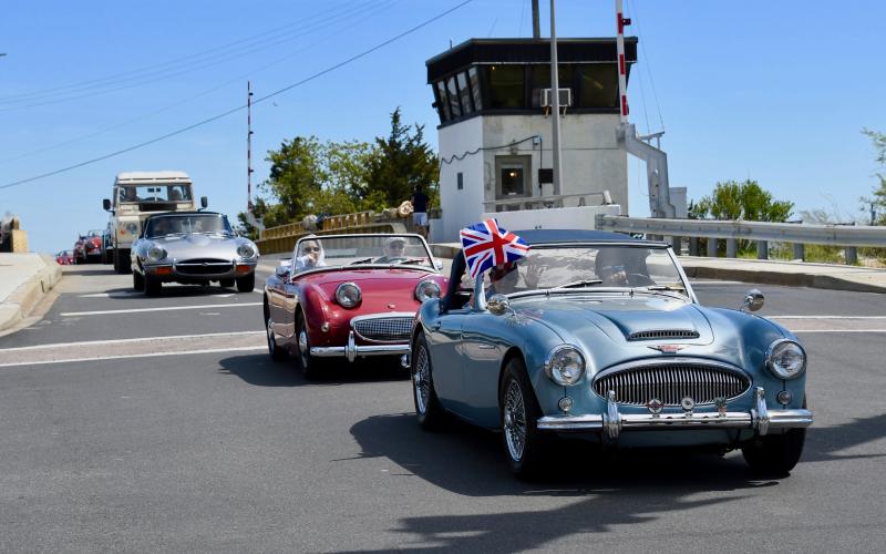 Mike Tyler, founder and organizer of the car show, leads the entourage across the Lewes-Rehoboth Canal.