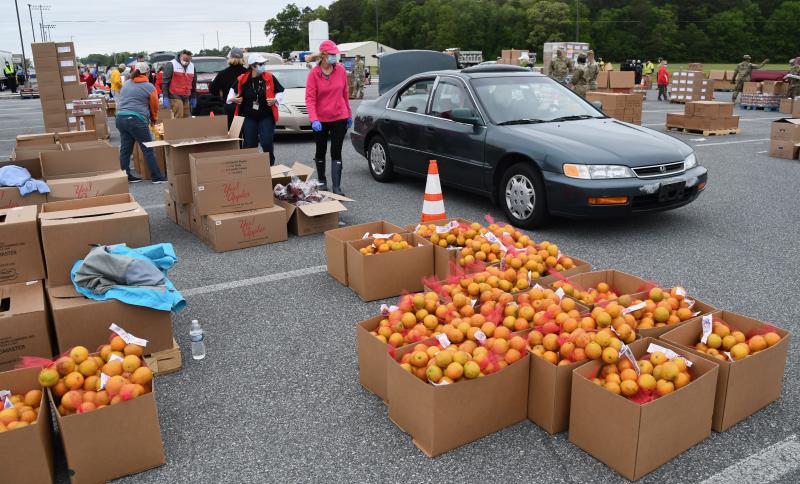 Bags of oranges are among the food staples handed out during the event.