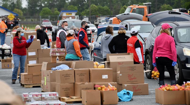 Volunteers are ready to load food into vehicles during the second Delaware Food Bank mass distribution in Sussex County since the COVID-19 state of emergency was put into place.