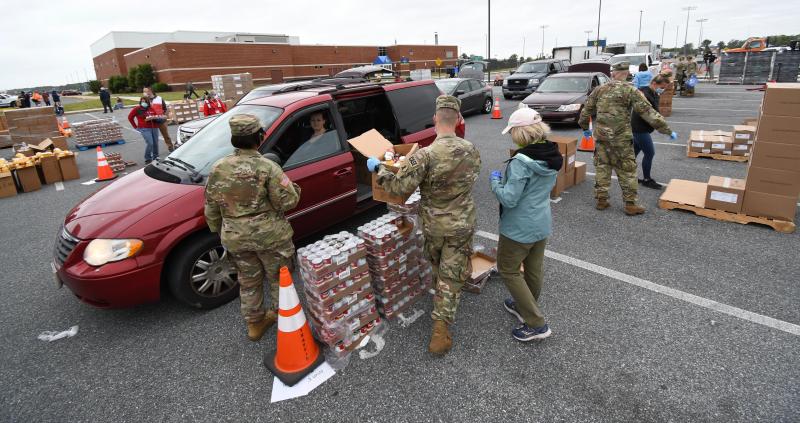 Long lines of vehicles are loaded with food even before the official start of the May 18 event.