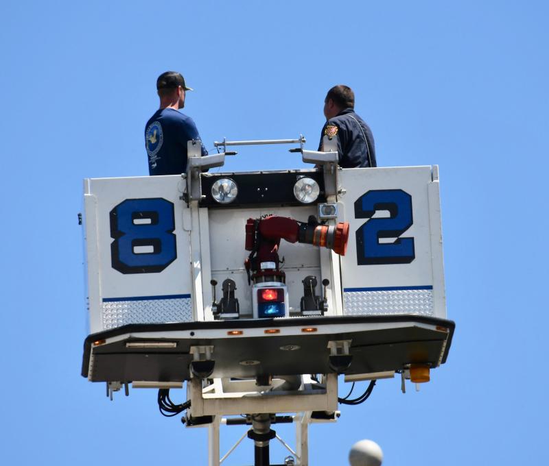 Two members of the Lewes Fire Department have the best seat in the house.