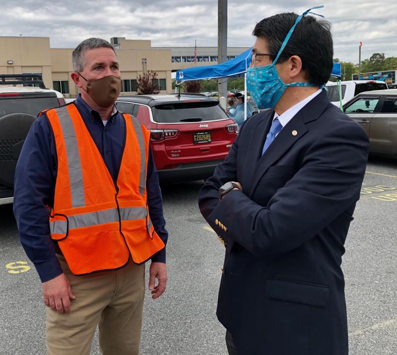 Mountaire Farms President Phillip Plylar, left, speaks with Dr. David Tam, president and CEO of Beebe Healthcare, at a recent testing event at Mountaire Farms’ Millsboro plant. SUBMITTED PHOTO