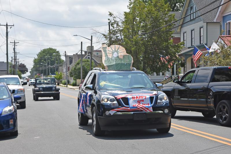 The parade began with only four cars but grew as it went on.