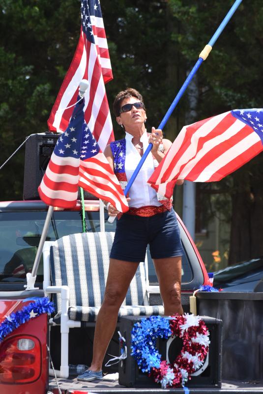 Diana Hoenen stands in the back of her husband’s truck.