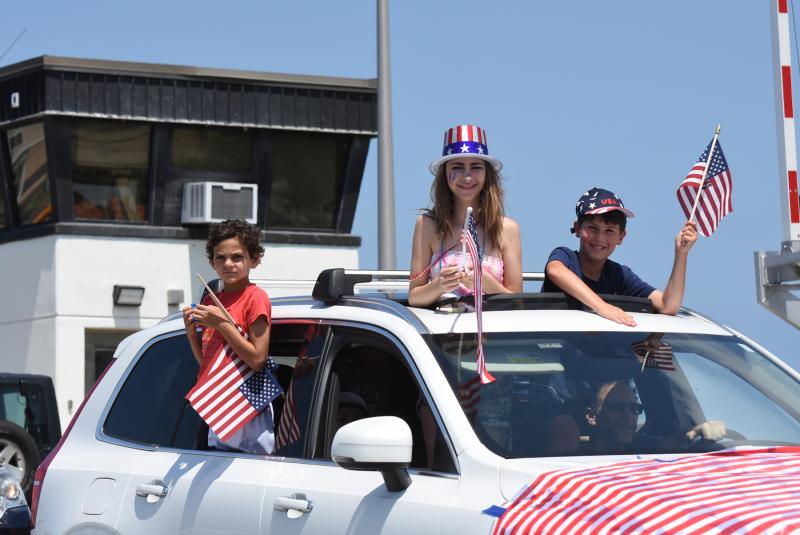 Several cars joined the parade after it started.