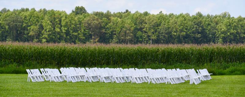 Out sitting in the field? Chairs are set up for a wedding on the Covered Bridge Inn property.