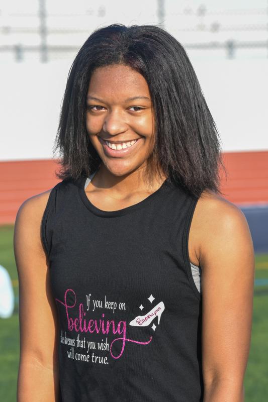 Rising eighth-grader Brooklyn Blackwell works out with Cape cheerleaders.
