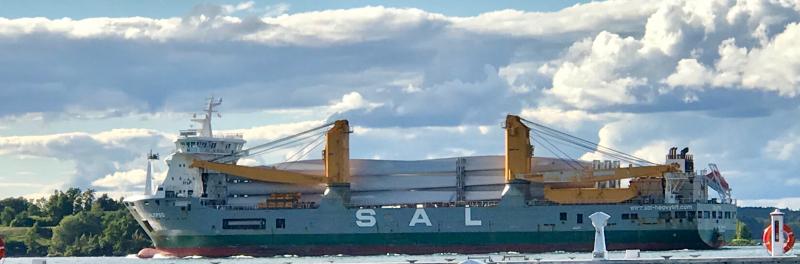 A westbound freighter on the St. Lawrence River carries wind turbine components toward Great Lakes ports. We saw extensive clusters of turbines on hilltops in rural areas of upstate New York near windy Lake Ontario. DENNIS FORNEY PHOTOS