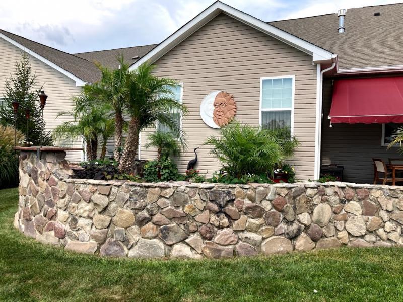 Dan Jayjock’s artistic skills are shown in the sun and moon carving displayed in the patio area and the white egret trellis.
