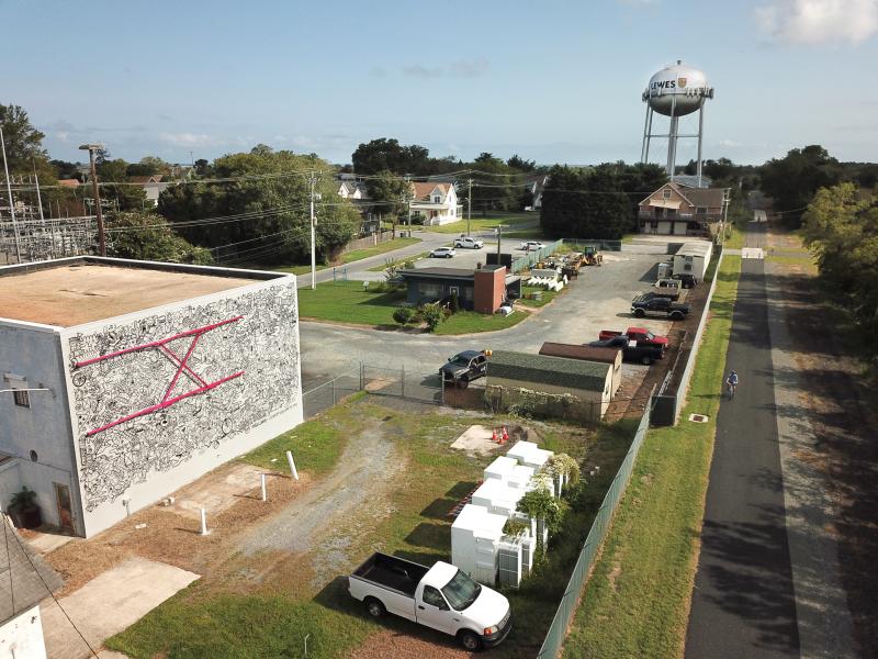 The mural is on the back of a former power plant building that faces the Lewes-to-Georgetown Trail.