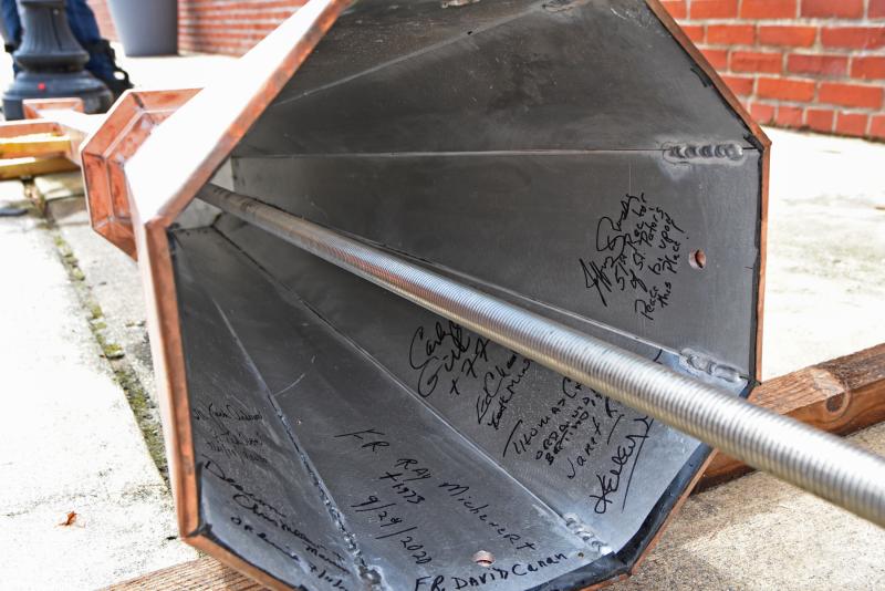 St. Peter’s clergy signed the inside of the new cross.