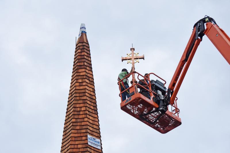 Andrew Lewandowski and Gerardo Hernandez of Bayside Exteriors head up to the steeple.