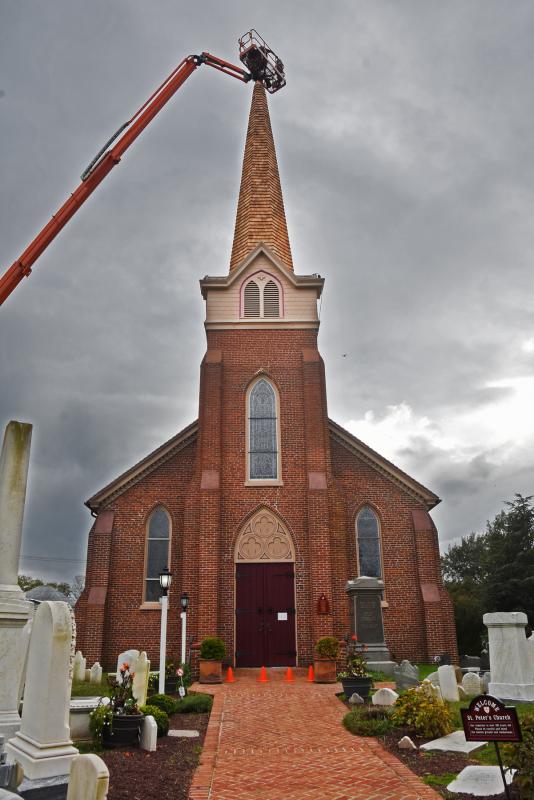 The cross installation took place on a dark, stormy and windy day.