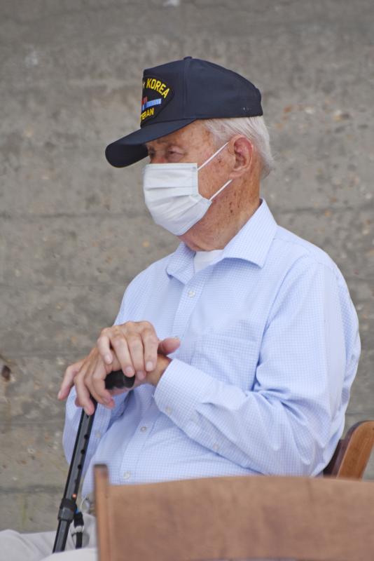 World War II and Korean War veteran Rudy Swanson, 92, watches the V-J Day ceremony.
