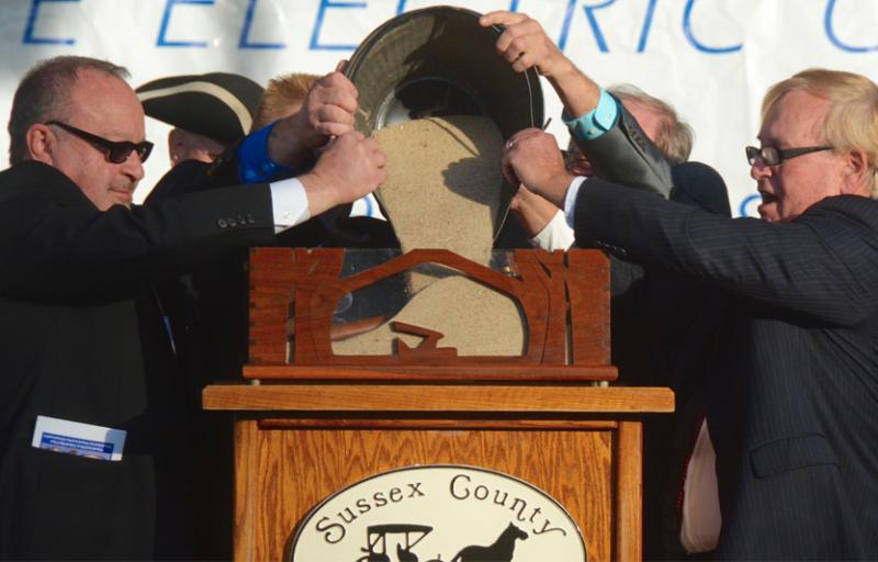 Burying the hatchet symbolizes the end of political rivalries as part of Sussex County Return Day celebrations. RON MACARTHUR PHOTO