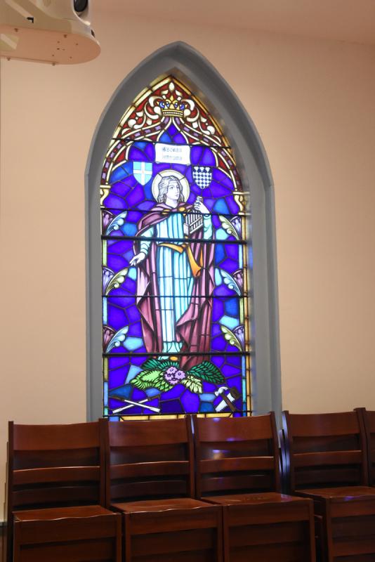 In the new choir area, there is a stained glass window featuring St. Cecilia, the patron saint of music.
