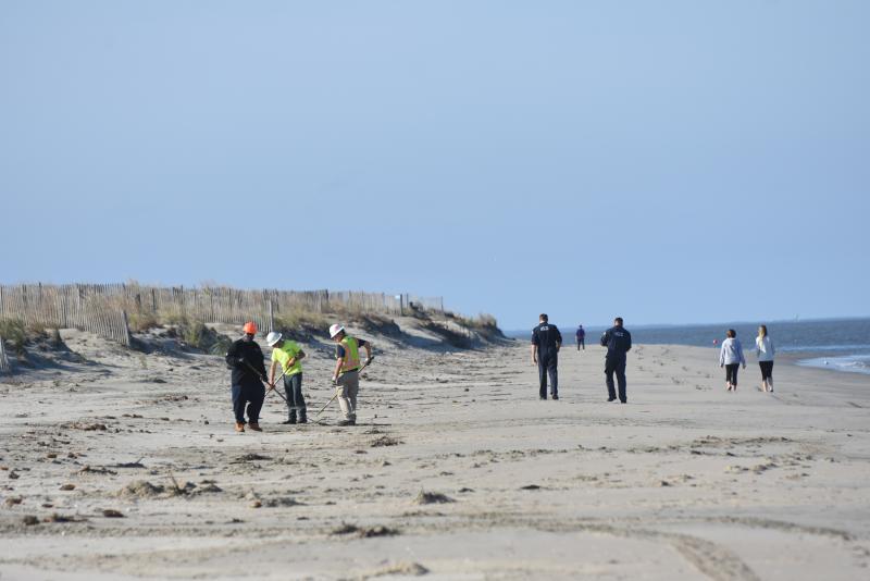 Crews have been working to clean the beaches of oily sand and tar balls for more than two weeks. NICK ROTH PHOTO