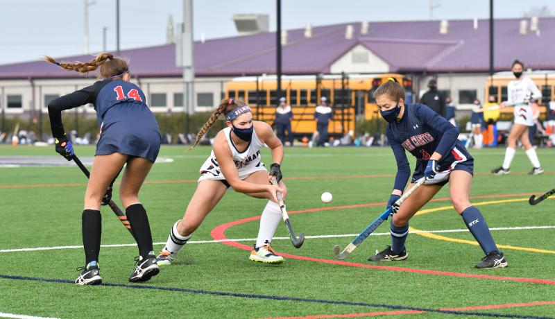 Delmar captain and last season’s Player of the Year Josie Hollamon takes it inside the circle between Addison Nelson, left, and Mary Catherine Anson, right. DAVE FREDERICK PHOTOS
