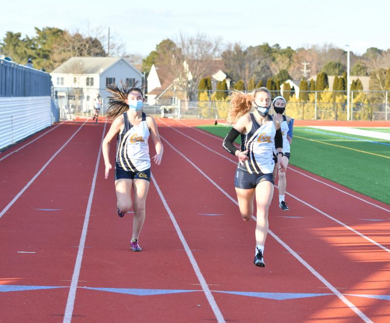 Hannah Maney and Lacey Shockro run the 400 meters for Cape. DAVE FREDERICK PHOTO