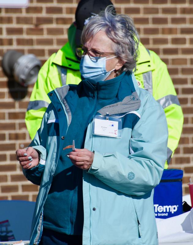 Nurse Elaine Morris is ready to administer a vaccine at the drive-through clinic this past weekend in Dover.