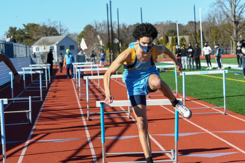 John Small wins the 55-meter hurdles.