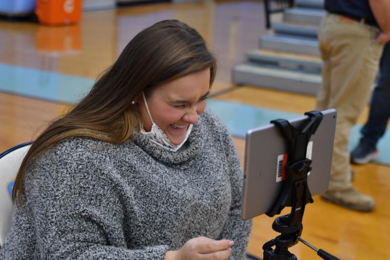 Laci Dixon takes iPad videos at wrestling matches. It’s just impossible to keep her from smiling. DAVE FREDERICK PHOTOS