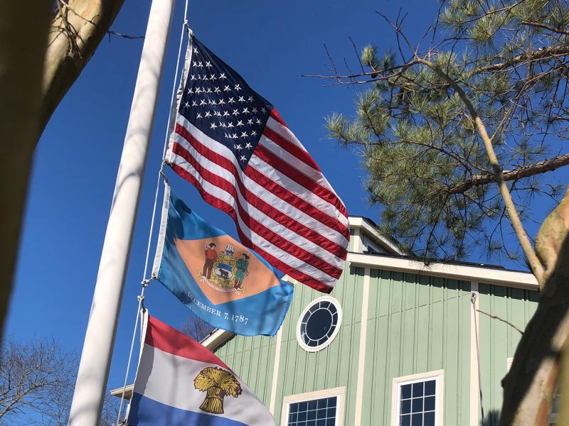 Flags fly at half-staff outside the Cape Gazette office in memory of the people who have died from COVID-19. BERNADETTE HEARN PHOTO