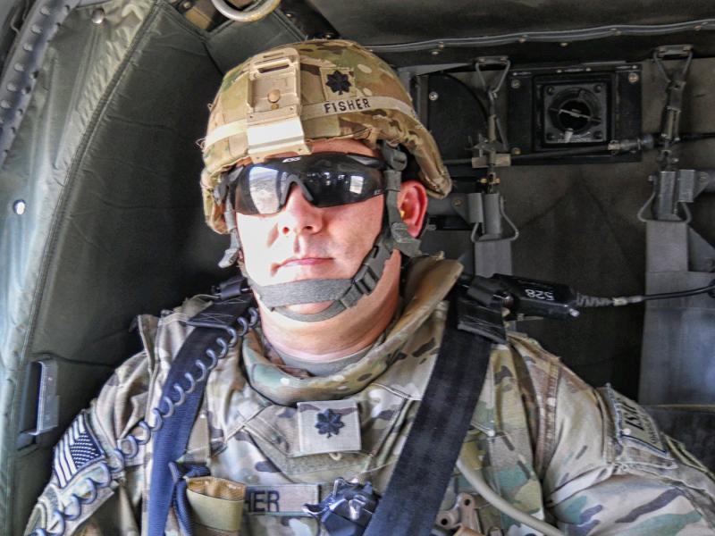 Lt. Col. John Fisher, now retired, is shown in a helicopter while on active duty in Afghanistan. SUBMITTED PHOTO