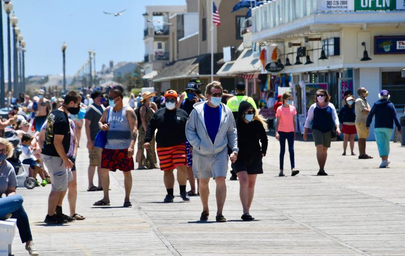 When the Rehoboth Beach Boardwalk reopens May 15, 2020, crowds quickly return. Rehoboth officials, as with most other municipal leaders, enact mandatory face coverings throughout the city.