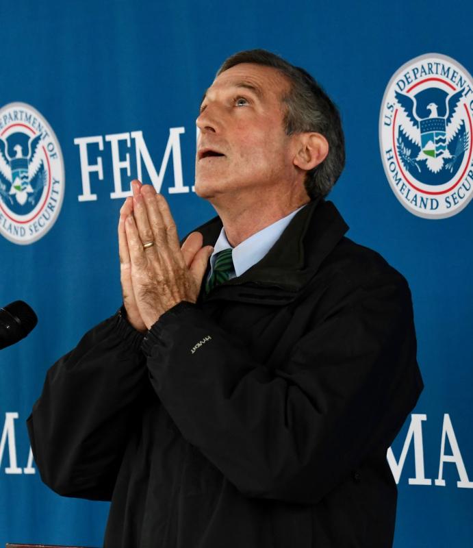 Gov. John Carney, shown at a Feb. 22 press conference, looks skyward hoping for emergency approval of the Johnson & Johnson vaccine. The first doses of the new vaccine arrived in Delaware March 2.