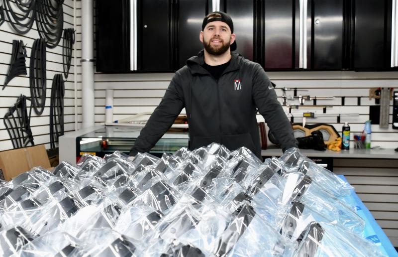 Matt Schaeffer, a high-end fabricator at Sound FX in Lewes, leads the company’s effort starting in March, 2020, to make protective face shields for local healthcare workers. The pandemic triggers a wave of mask and shield making by companies and individuals.