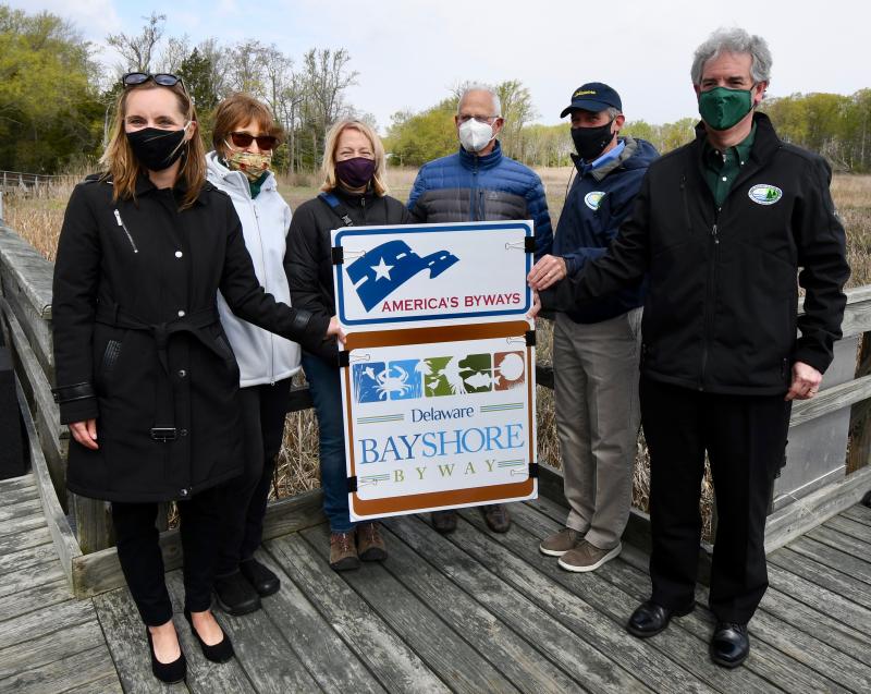 Unveiling the new America’s Byways sign are (l-r) DelDOT Secretary Nicole Majeski; Ann Gravatt, Delaware Greenways; Karen Bennett, Division of Fish and Wildlife; Steve Borleske, Delaware Greenways; Gov. John Carney; and DNREC Secretary Shawn Garvin. RON MACARTHUR PHOTOS