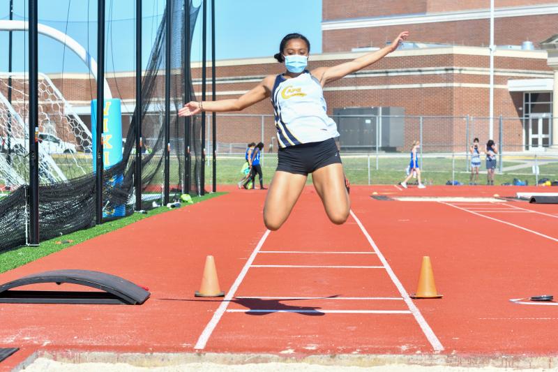 Aya Daisey makes an attempt at the long jump.