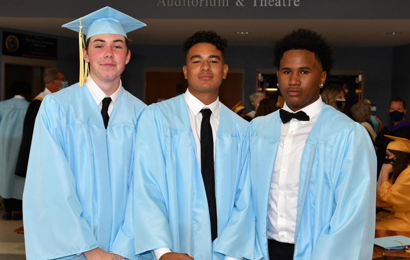 Friends (l-r) Douglas Heid, Derek Alves and Jalen Myers await the instructions for the processional.