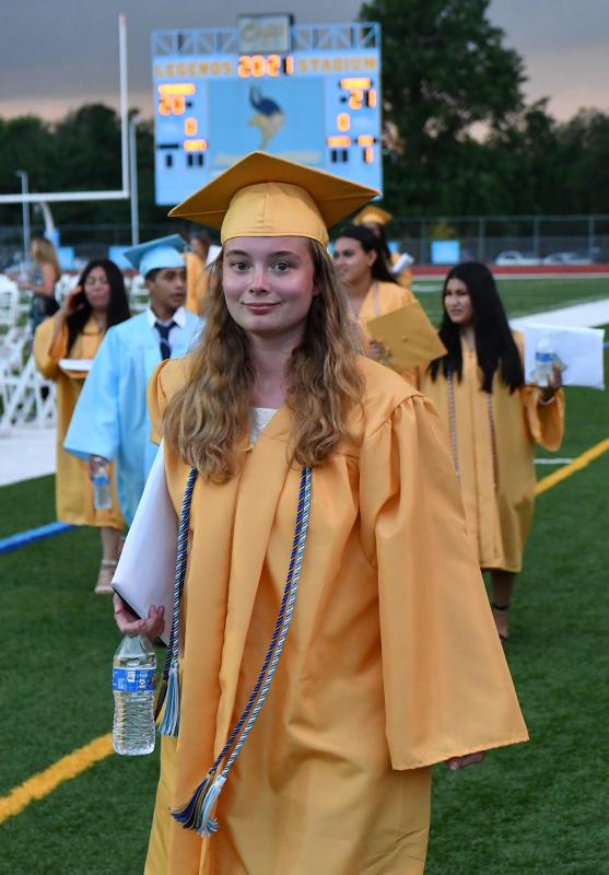 Jonna Mobius smiles as she exits the stadium during the recessional.