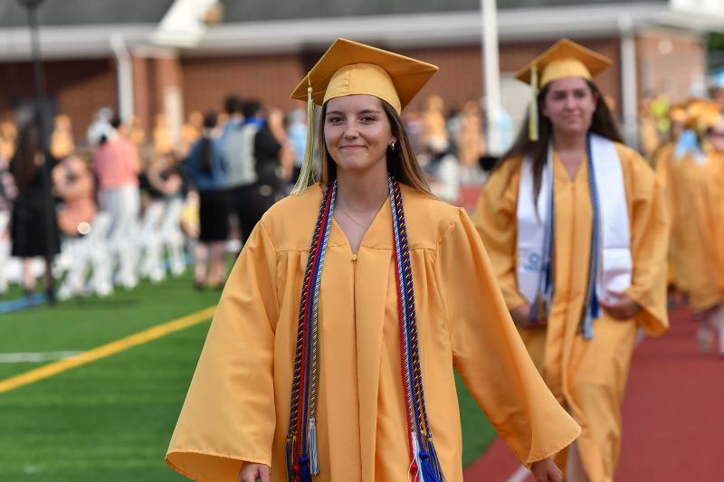 Lindsay Rambo has a big smile as she walks in the processional.