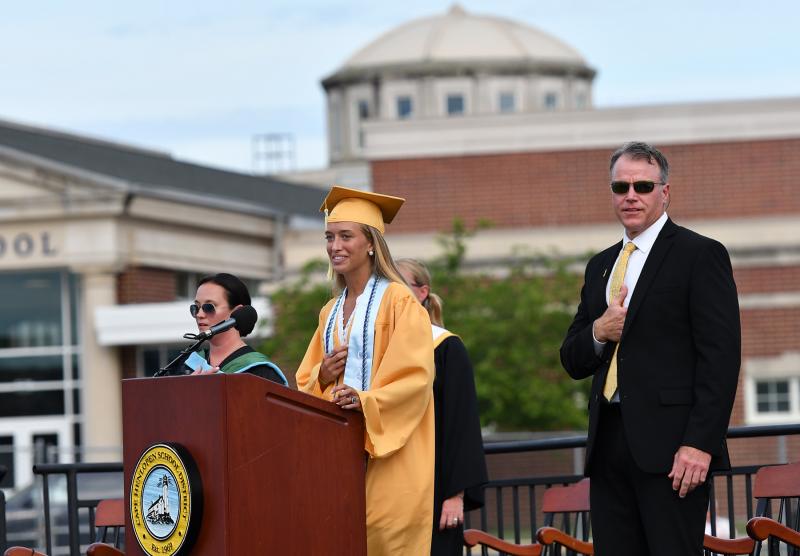 Class of 2021 Vice President Destiny Kusen leads the stadium in the salute to the flag.