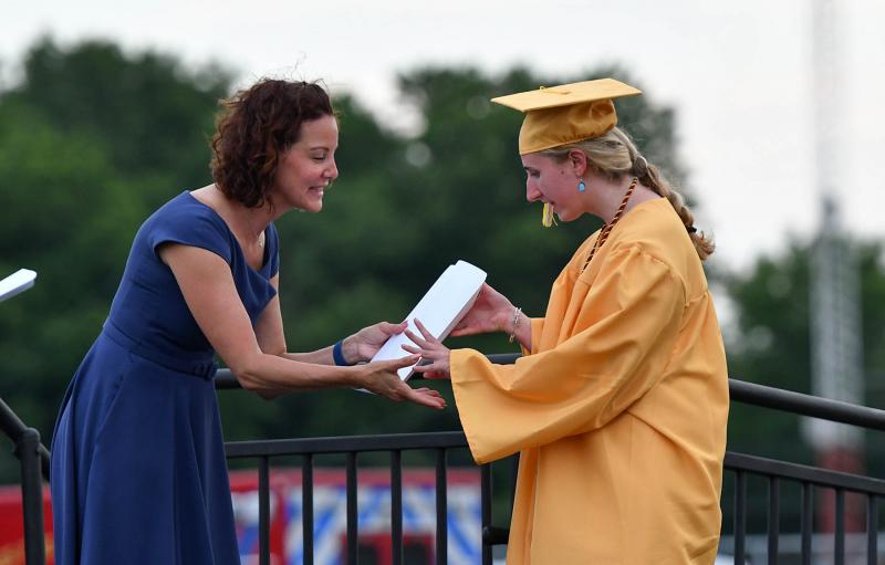 Lilly Barnett receives her diploma from Cape board President Dr. Alison Myers.