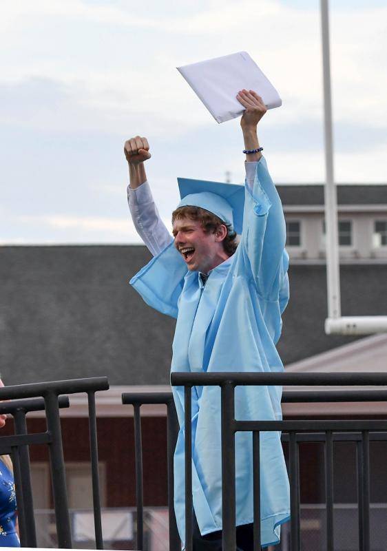 Matthew McClung shows his emotions after receiving his diploma.
