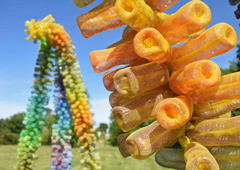 Each stalk is made of repurposed plastic bottles covered in a mesh-like material.