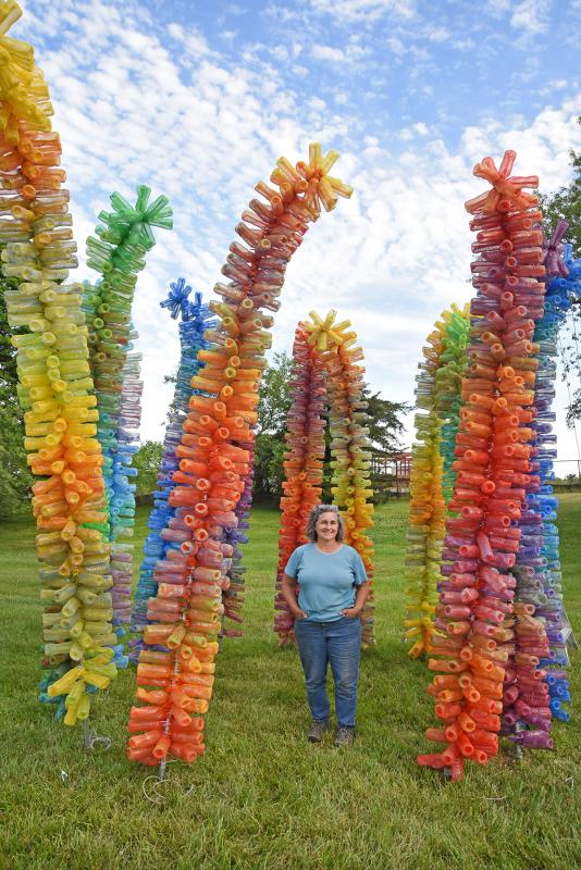 Artist Kate Dodd created 14 vertical sculptures made from repurposed water bottles.