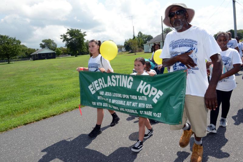 Leading the Everlasting Hope Ministries marchers in 2019 are (l-r) Raeleigh and Raniyah Morris, and Raymond Mars. FILE PHOTOS