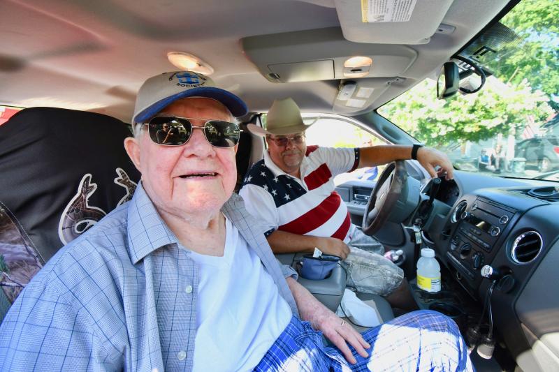 Edward Shockley, 93, left, gets a comfortable ride thanks to his son, Mark. His father is the official host of the annual parade.