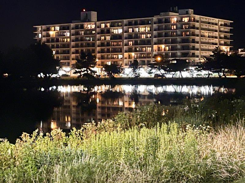The lights of Rehoboth’s Henlopen Hotel reflect in the waters of Lake Gerar on a summer evening. DENNIS FORNEY PHOTO