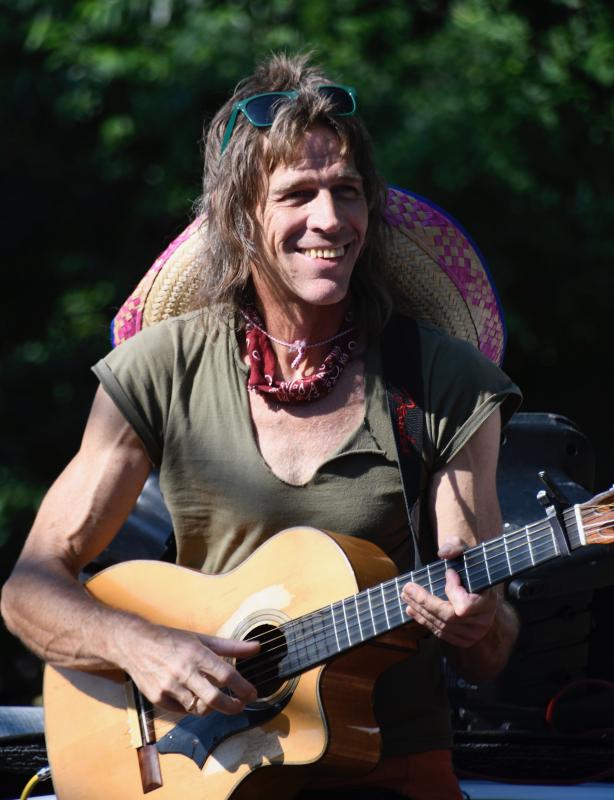 David Aman, a member of the local Hot Sauce Band, provides some musical heat along the parade route.
