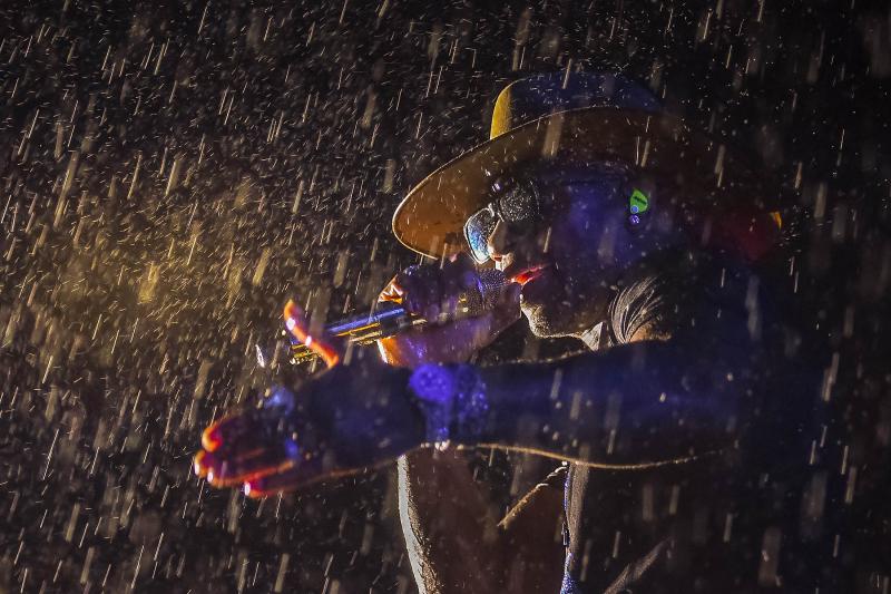 Jimmie Allen sings through the downpour.