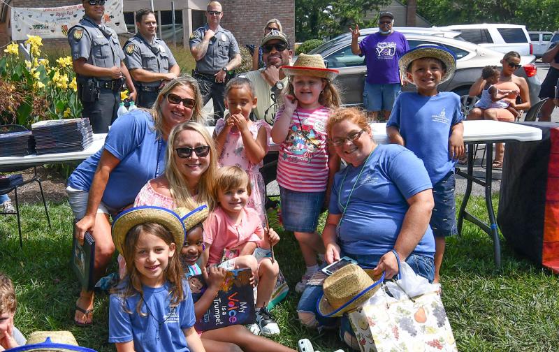 Kids and staff from the Children’s Beach House take a picture with Jimmie Allen.
