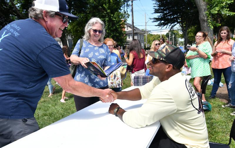 Cape grad and country music star Jimmie Allen held a book signing for his children’s book “My Voice is a Trumpet” Aug. 5 at Stango Park in Lewes. Nearly 200 fans gathered to see the Academy of Country Music’s New Male Artist of the Year. Former Cape teacher Steve Denver and his wife Judy get a book for their son Nate, who played basketball with Allen at Cape.